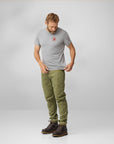 man wearing grey melange round neck t-shirt and green pants