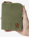green zip pouch with arctic fox logo