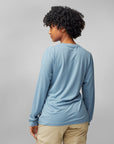 woman wearing light blue long sleeve shirt