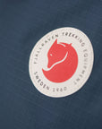 Fjällräven Trekking Equipment logo on a blue textured background