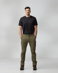 Man wearing a black t-shirt and green pants on a white background