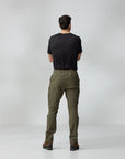 Person wearing olive green pants and a black shirt on a white background