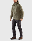 buckwheat brown-dark grey windbreaker jacket with hood and black trekking trousers