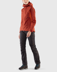 orange windbreaker jacket with hood and black pants