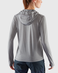 woman in shark grey base layer hoodie