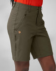 Green shorts with a arctic fox logo on a gray background