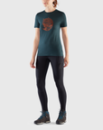 woman in navy round neck t-shirt and black tights