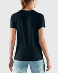 woman wearing black round neck t-shirt with light blue shorts