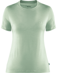 Light green t-shirt with a small logo on a white background