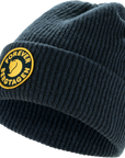 Dark blue knit beanie with a yellow Fjällräven logo on a white background