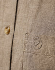 pocket detail of a brown shirt