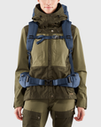 woman carrying navy trekking backpack