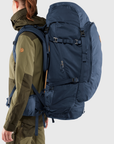 woman carrying storm-dark navy trekking backpack