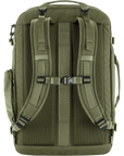 Green backpack with multiple straps and zippers on a white background