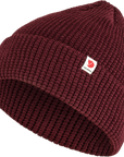 dark garnet knitted beanie hat with Fjällräven logo