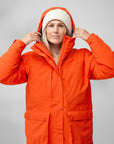 woman wearing orange padded windbreaker jacket with hood