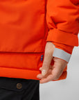 sleeve detail of orange padded windbreaker jacket with sweden flag tag