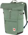 A green High Coast Foldsack 24 backpack with a roll-top closure and a front pocket, featuring padded shoulder straps and a small red Fjällräven logo.