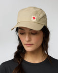 woman in fossil baseball cap with Fjällräven logo