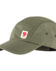 green baseball cap with Fjällräven logo