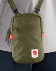 green small sling bag with Fjällräven logo
