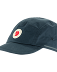 Dark blue cap with a Fjällräven logo on a white background