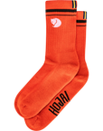 Orange socks with black text and a fjallraven logo on a white background