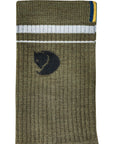 Green sock with a fjallraven logo on a white background