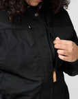 Person wearing a black jacket with a white background