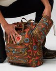 Person holding a patterned bag with a white background