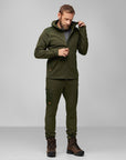 man unzipping deep forest fleece jacket with hood with green trousers