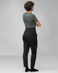 woman in grey top and black trekking trousers