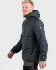 man wearing basalt padded winter jacket with hood with arctic fox logo