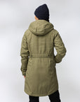 Person wearing a green parka coat on a white background