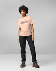woman wearing pink round neck t-shirt and black trousers
