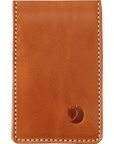 A brown leather card holder with visible stitching and a arctic fox logo embossed on the bottom right.
