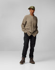 brown button long sleeve shirt with black trousers