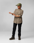 brown long sleeve shirt and black trousers