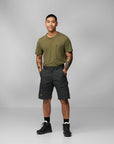 man in green top and dark grey Bermudas shorts