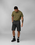 man in green top and dark grey Bermudas shorts