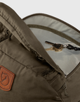 Brown bag with a keychain and visible Fjällräven logo on a white background