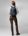 woman carrying navy Fjällräven backpack with logo