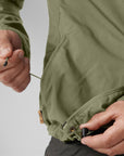 adjustable drawstring of green windbreaker jacket
