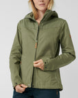 unzipping green jacket with hood