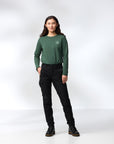 woman in green top and black trousers