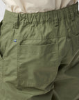 Green pants with a sweden flag logo on a white background