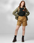 woman wearing black top and khaki bermudas shorts