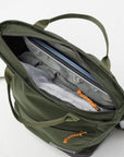 Green backpack with open compartment showing organized contents on a white background