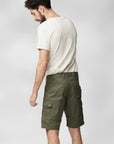 man wearing white Fjällräven t-shirt and green bermudas shorts