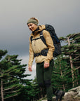Person hiking with a backpack in a forested area